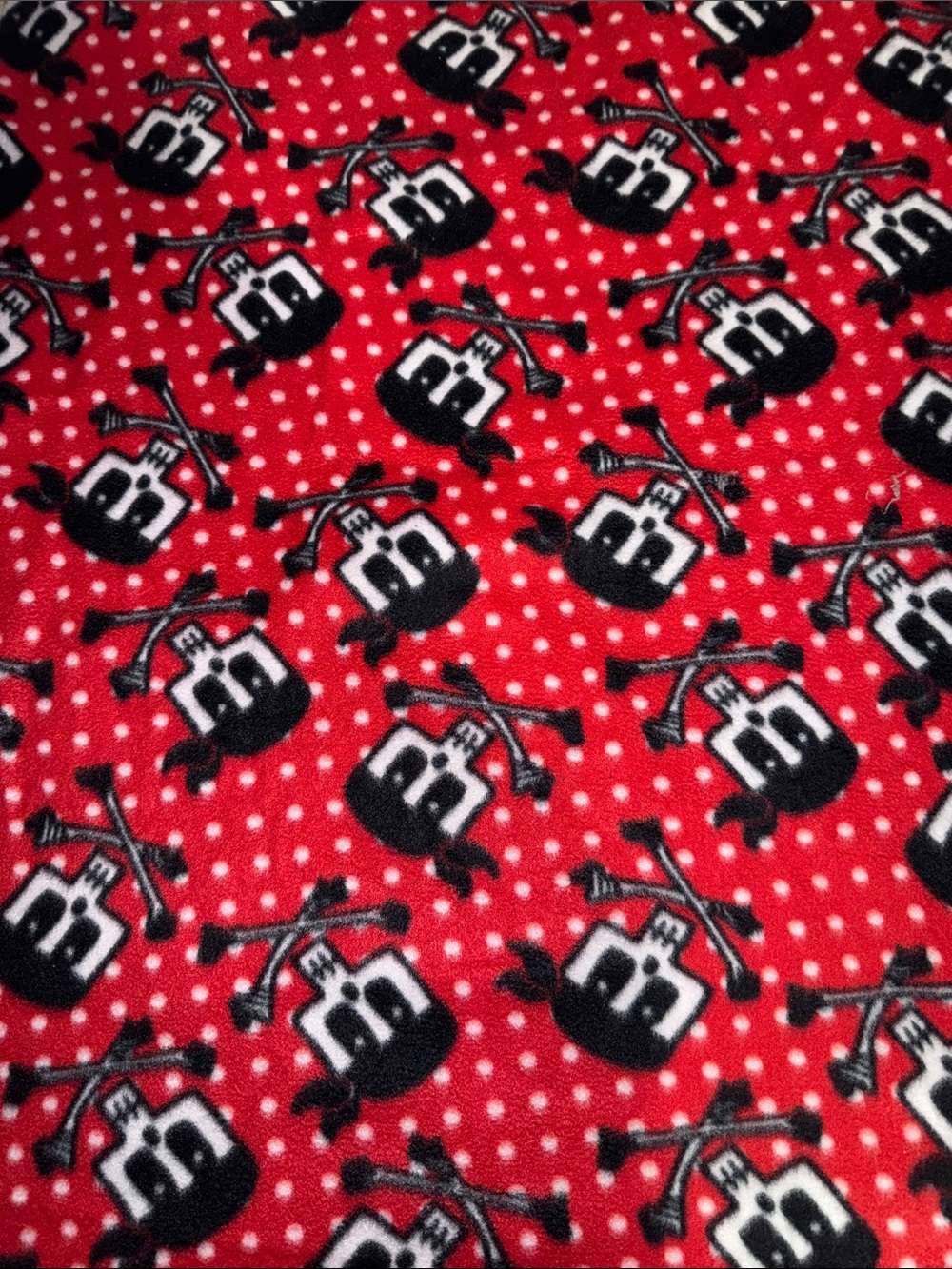 Red Polka Dot Skull & Crossbones Fleece Fabric
